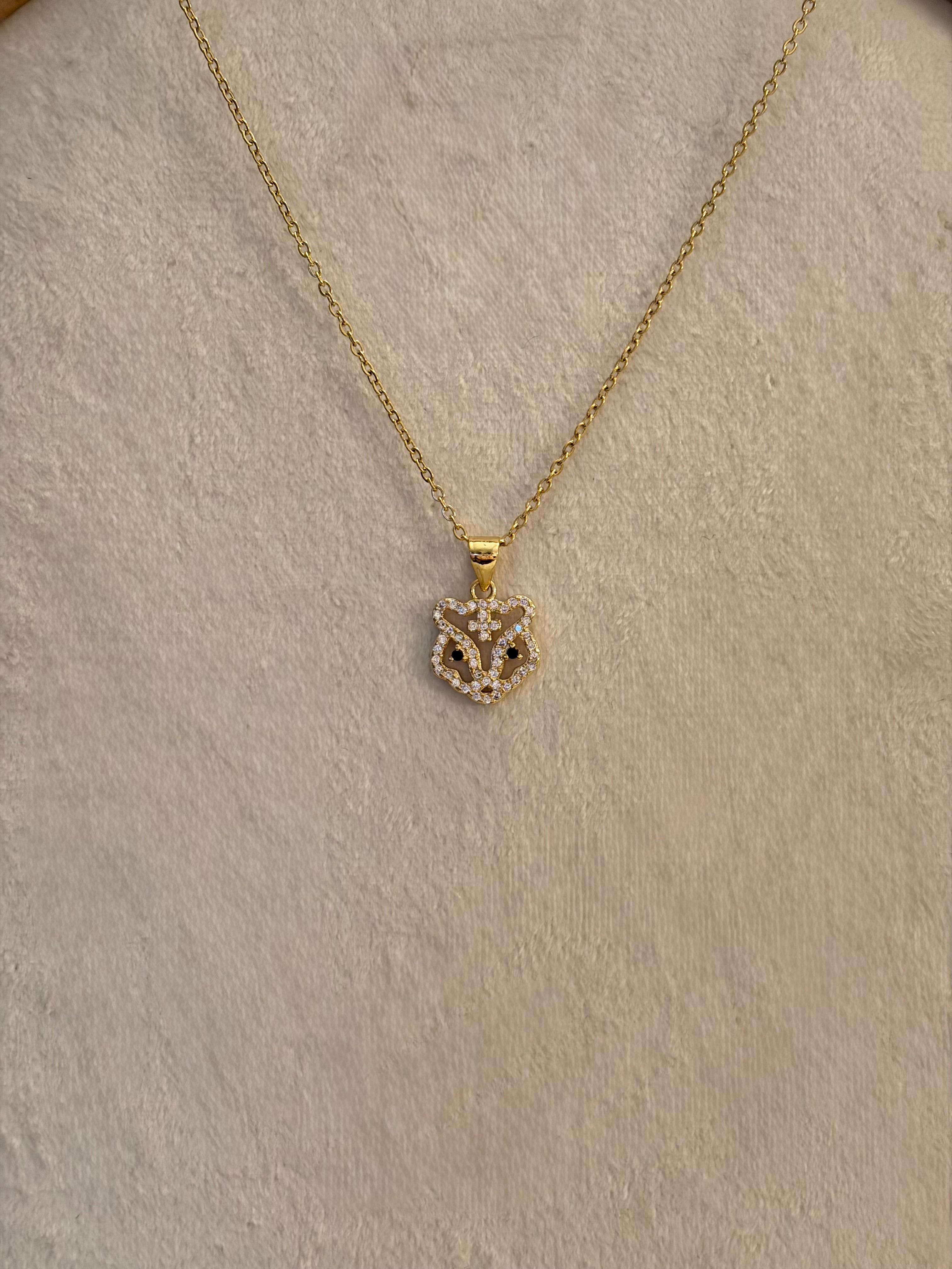 Stainless steel gold necklace with a tb pendant