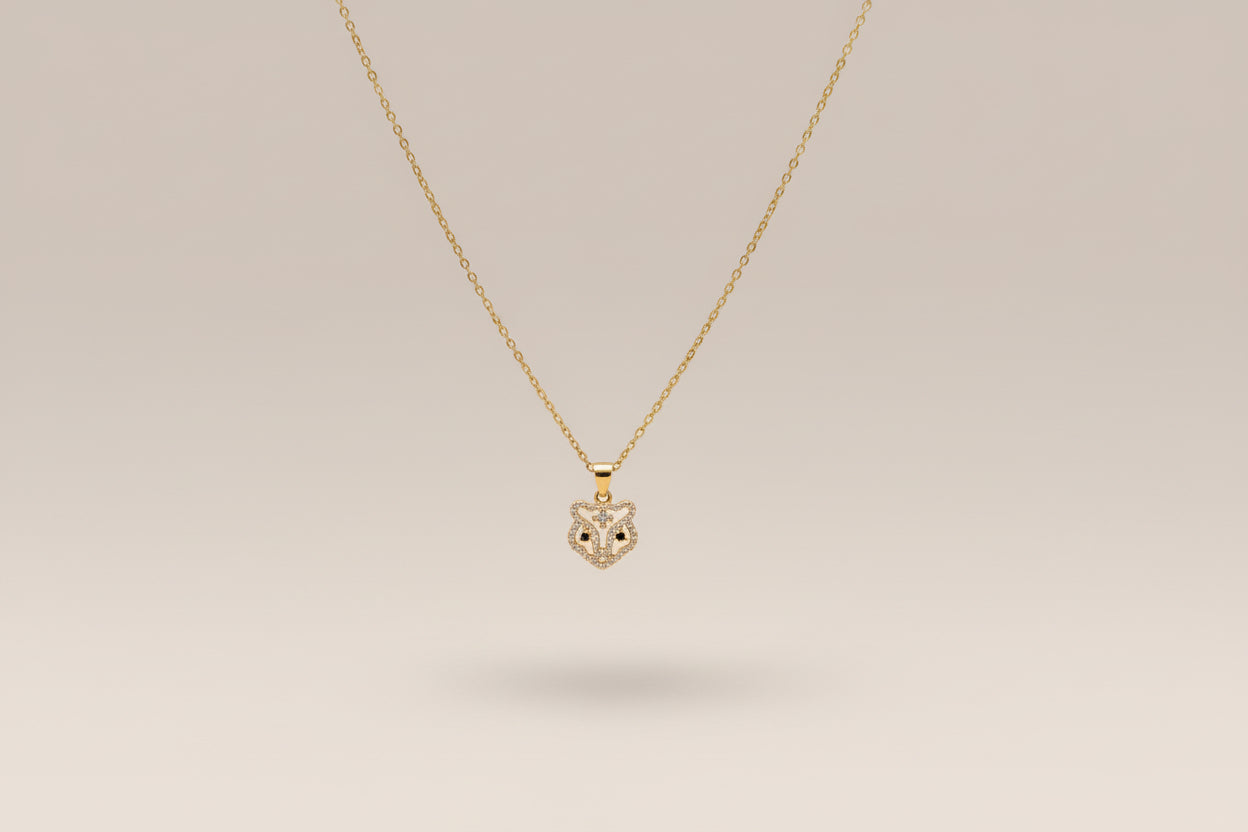 Stainless steel gold necklace with a tb pendant
