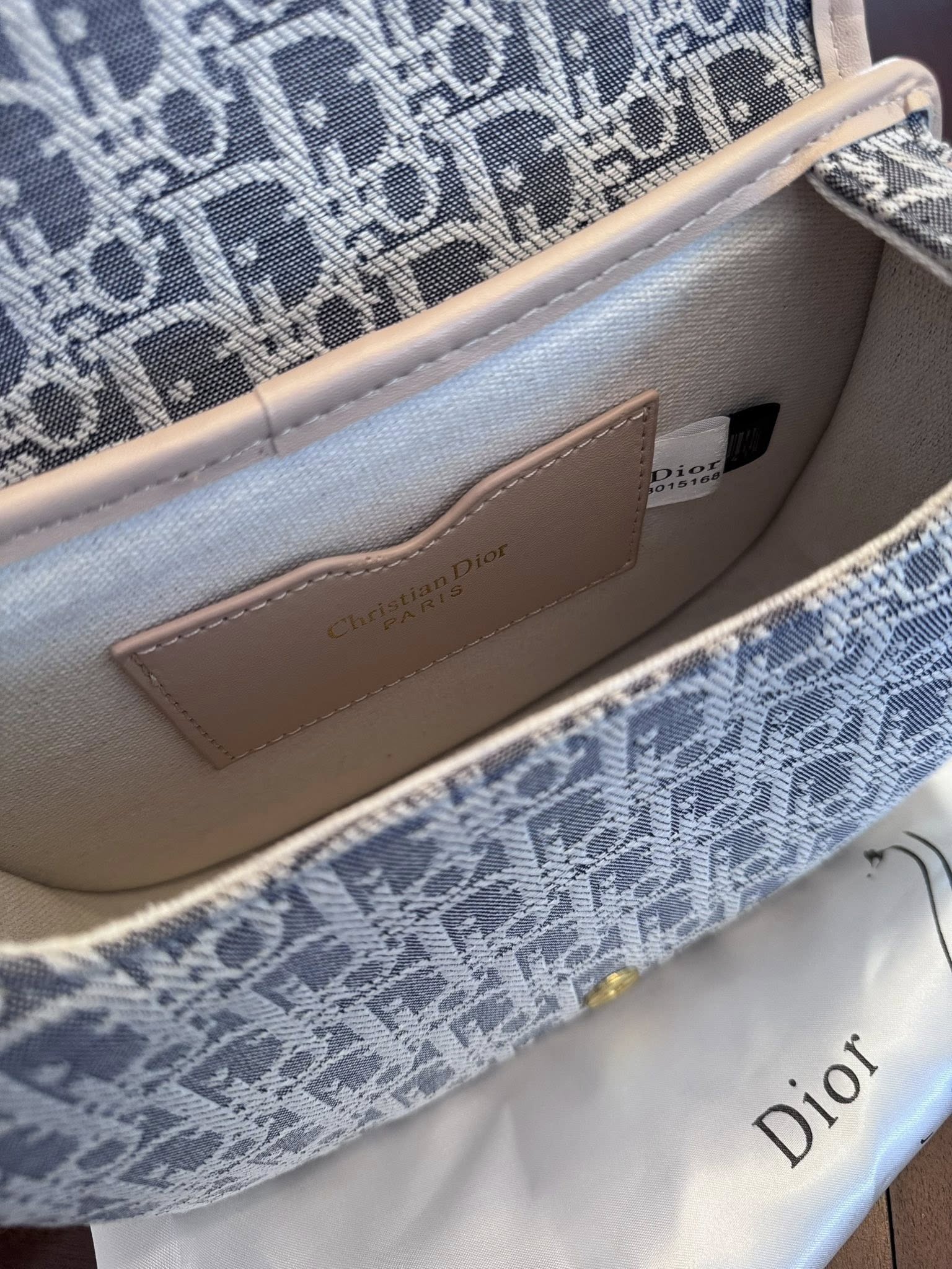 Crossbody classic monogram-inspired canvas in soft blue and cream tones