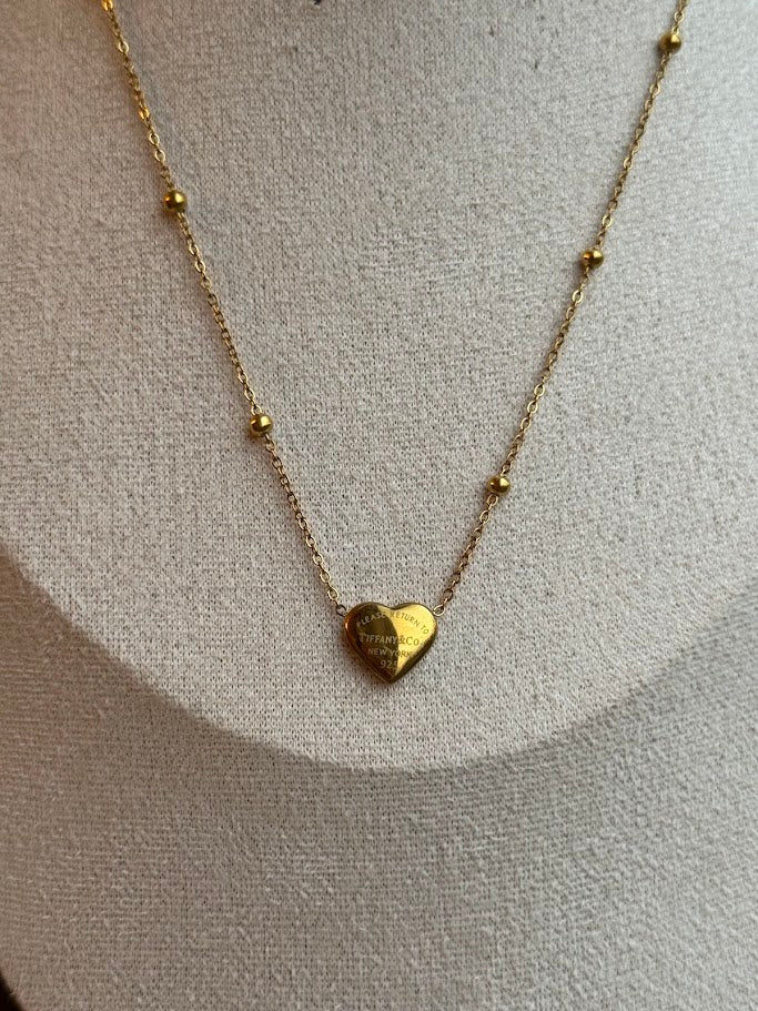Gold necklace with a heart pendant