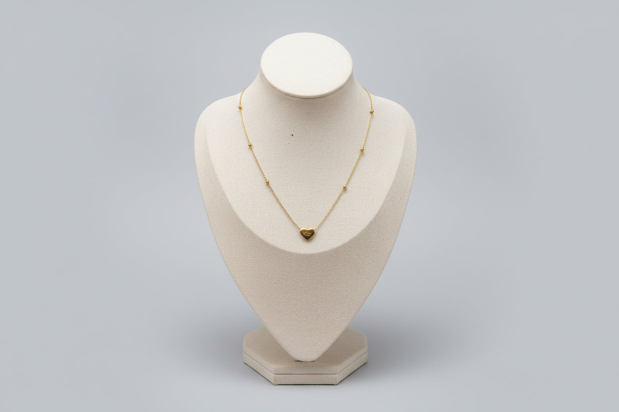 Gold necklace with a heart pendant 