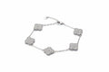 Silver bracelet with clover-shaped charms vc stones