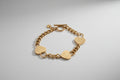 Gold bracelet with heart-shaped charms