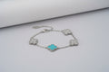 Bracelet with turquoise clover-shaped charms on silver with vc stones