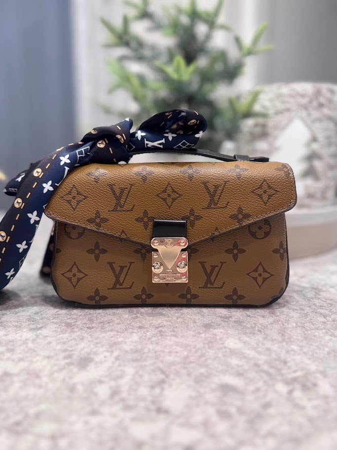 Two toned mini purse with front clasp closure