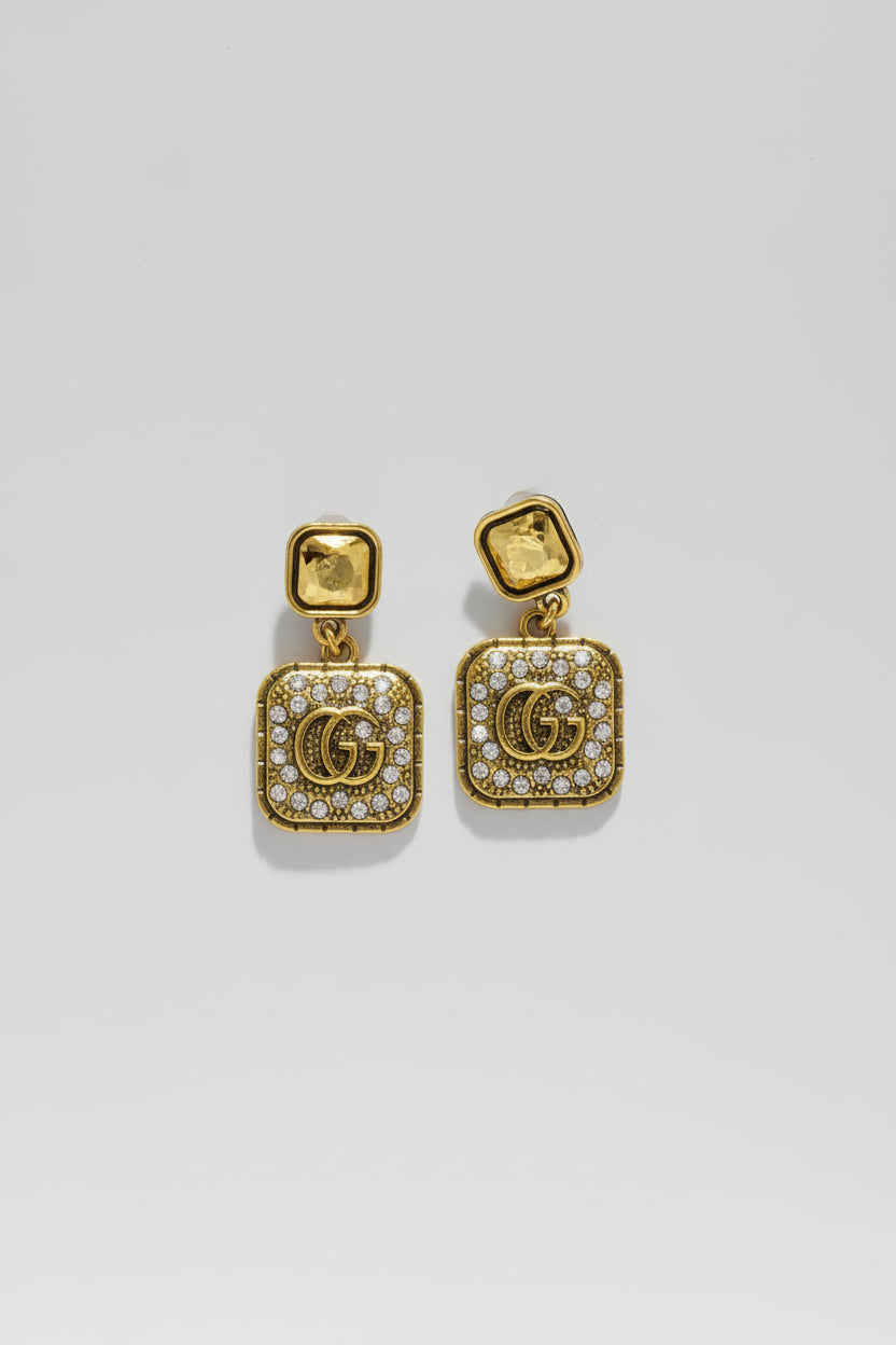 Gold square earrings with gemstones 