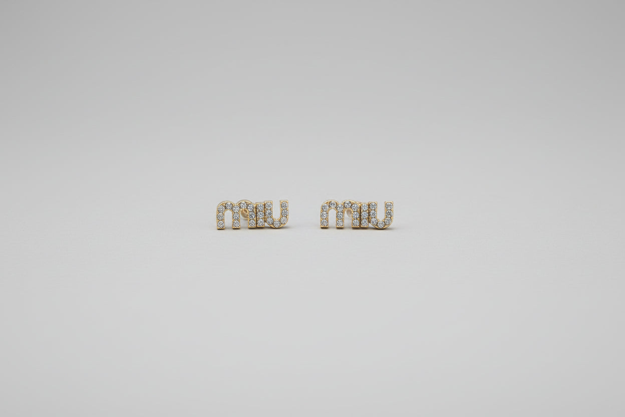 Gold-tone stud earrings adorned with crystal accents