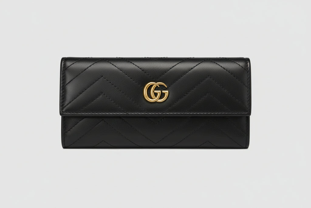 Black quilted wallet with gold logo 