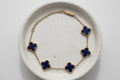 Bracelet with blue clover-shaped charms. Stainless S.