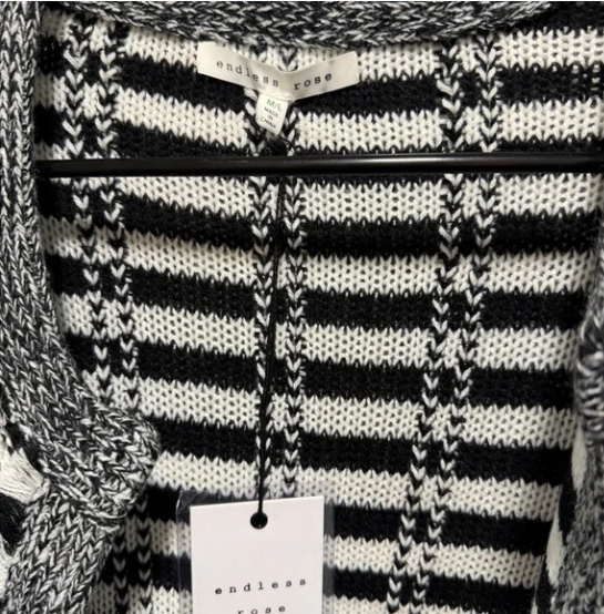 Black and white striped sweater with 'Endless Rose' tag