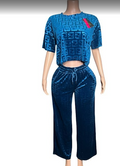 Mannequin wearing a blue textured top and pants set on a white background