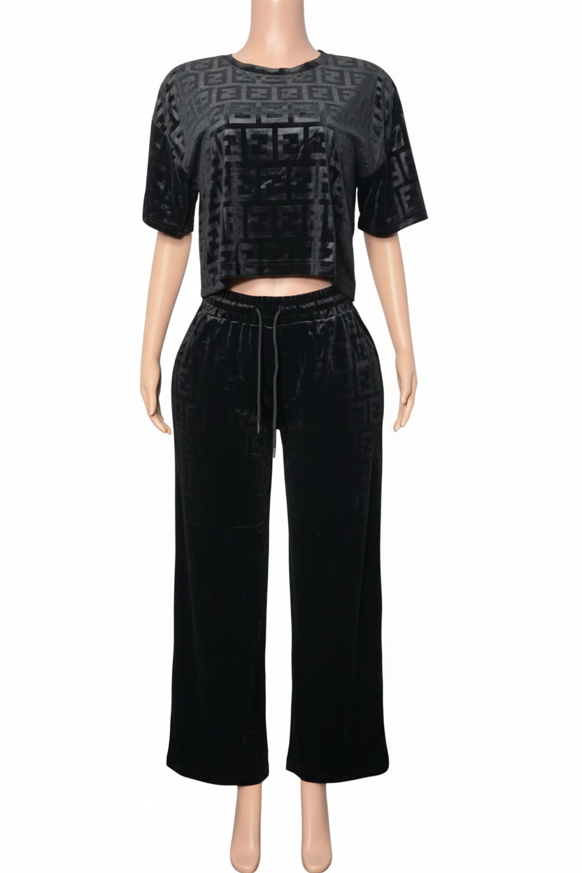 Black outfit with patterned top and wide-leg pants 