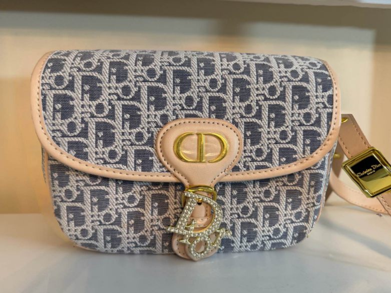 Crossbody classic monogram-inspired canvas in soft blue and cream tones